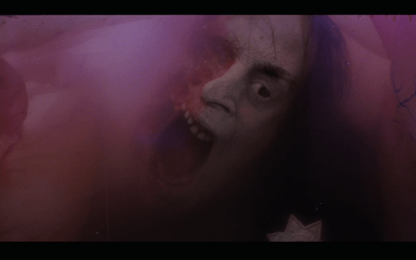 Nice pink painting. Oh wait, is that a dead guy?