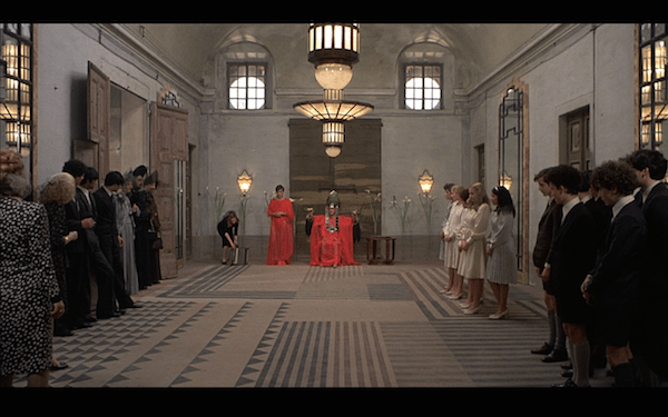 The use of a long shot with a lot of space.