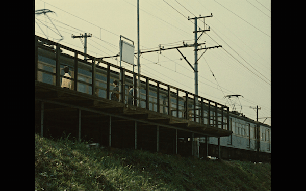 This train scene divides the film.